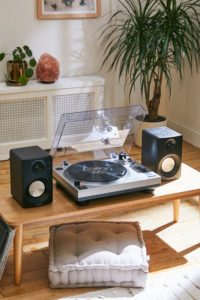 Crosley K100 Record Player With Speakers Premium stereo system from Crosley featuring their C100 record player + 2 S100 Bluetooth-enabled speakers. Turntable offers high-quality performance with both stereo phono and line-level pre-amp.  $390.00 • urbanoutfitters.com