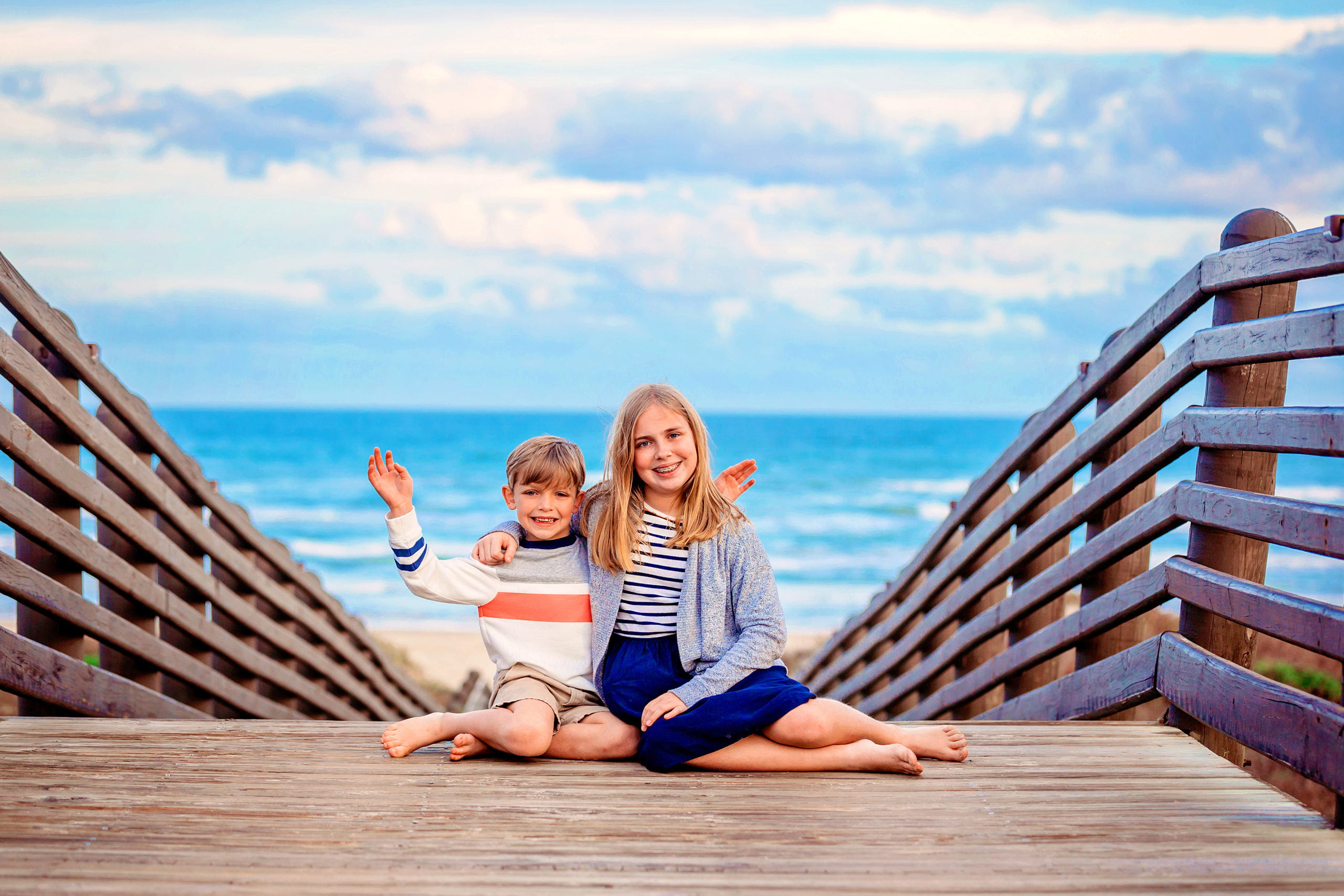 Michael & Abby pose on the bridge leading to the beach.