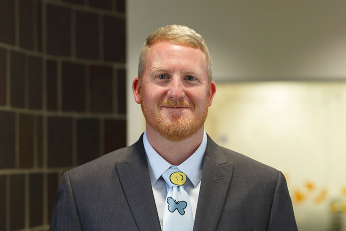 Picture of Parker Huston, PhD, Clinical Director of On Our Sleeves